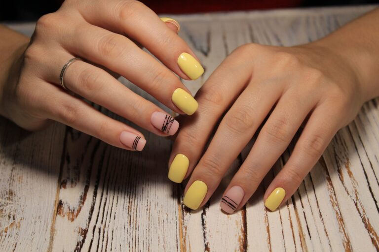closeup womans hand displaying trendy stylish gel manicure design salon min